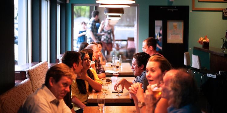 Photo of people socializing at a restaurant