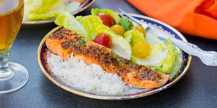 Photo of served salmon with white rice and veggies